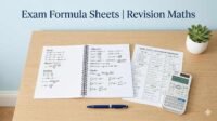 Exam maths formula revision sheet with notebook, calculator, and pen on a clean study desk for students preparing for board or entrance exams.