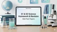 S1 and S2 Science homework and revision banner featuring textbooks, molecules, and SQA past papers on a study desk for RevisionTown.